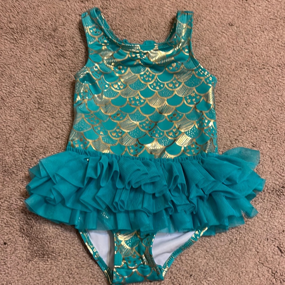 Girls size 4T swimsuit. Snap bottom.